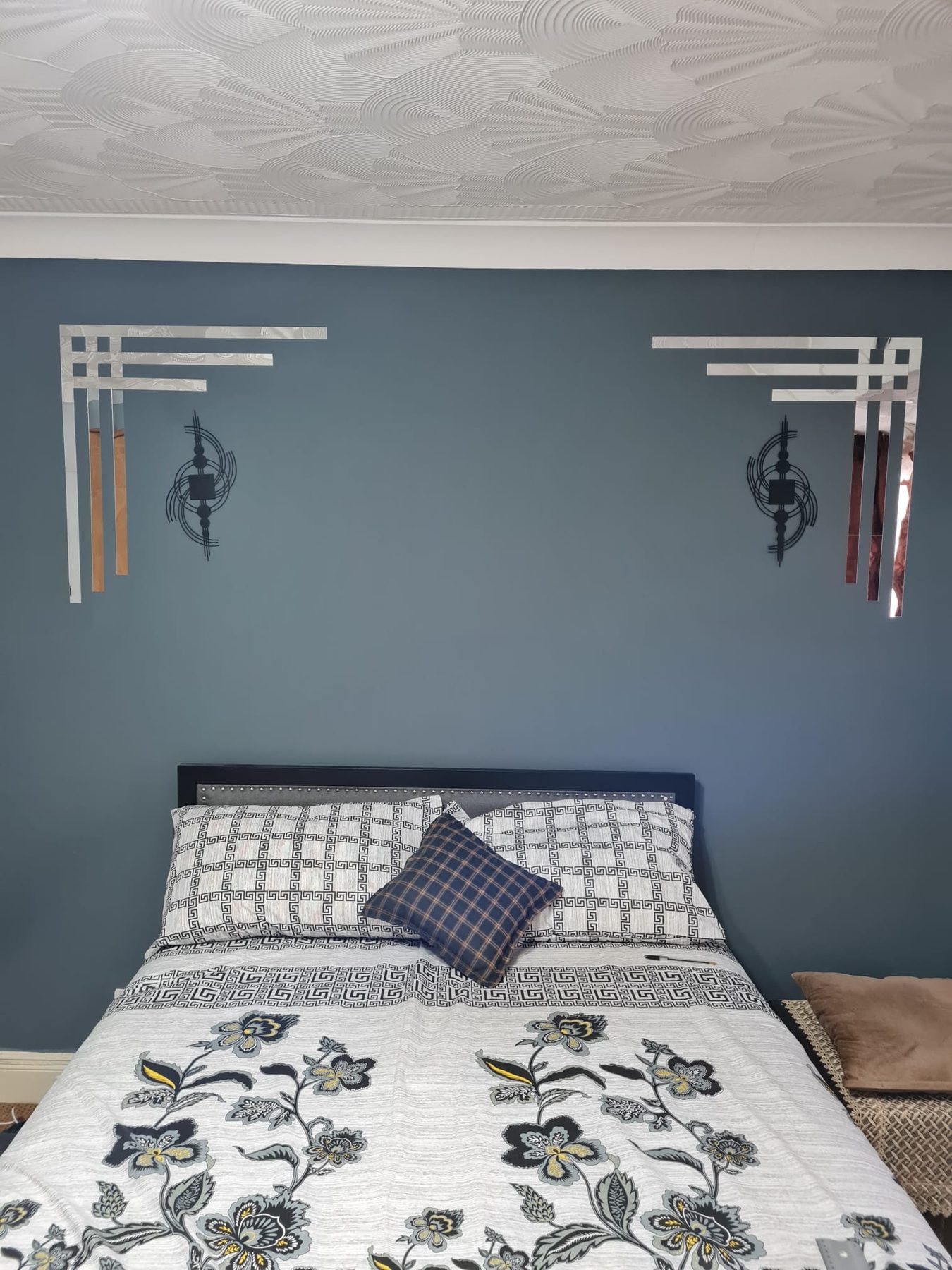 Blue bedroom feature wall with mirrored art deco detailing